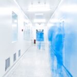 Blurry view of a hallway, showcasing an effective and speedy clean room manufacturing facility.