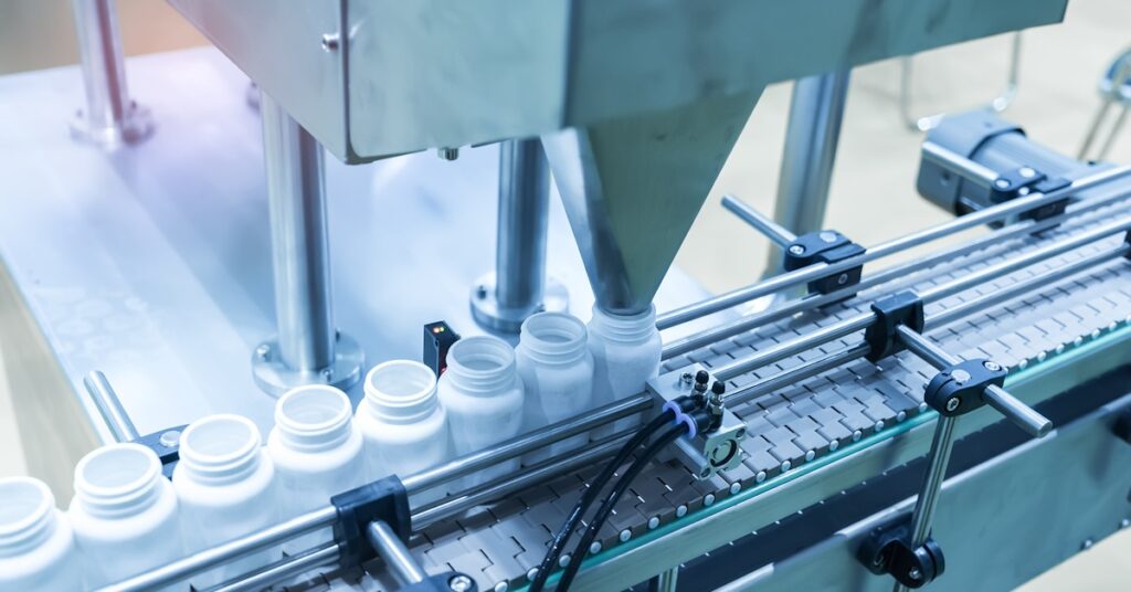 A machine efficiently works with precision, showcasing advanced technology in the MedTech industry.