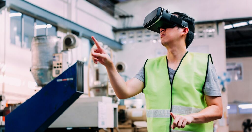 A factory worker using a VR headset, immersed in augmented reality to improve operational efficiency and training.