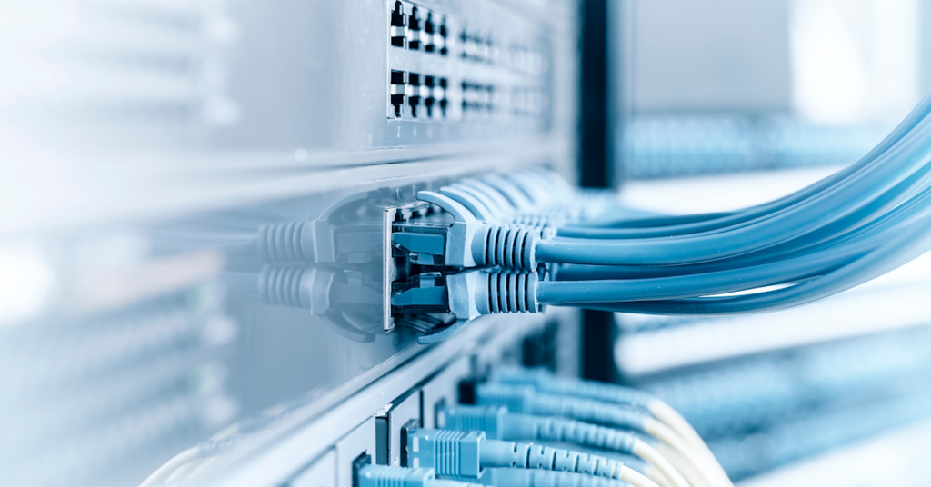 Close-up image of a Data Network Edge setup, adorned with several blue cables
