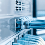 Close-up image of a Data Network Edge setup, adorned with several blue cables