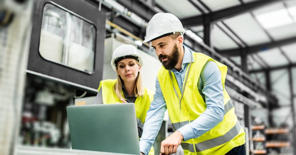 Engineers analyzing manufacturing data