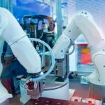 Robotic arms automating the manufacturing in a smart industry.