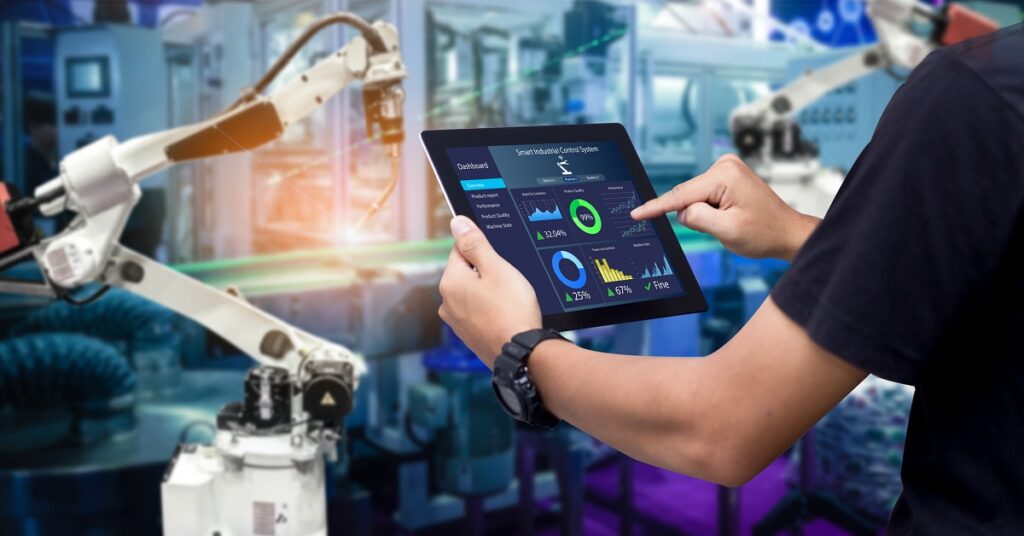 A man has is tablet open, where he is using MES System.