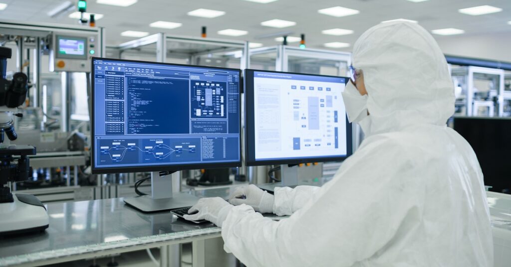 Scientists-in-Sterile-Suits-Working-with-Computers-Analyzing-Data-Semiconductors